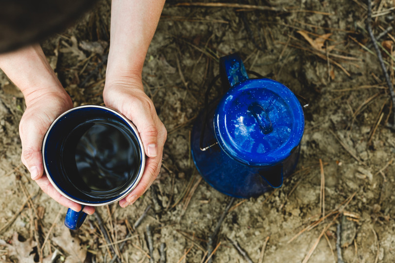 Kettle and cup in campsite