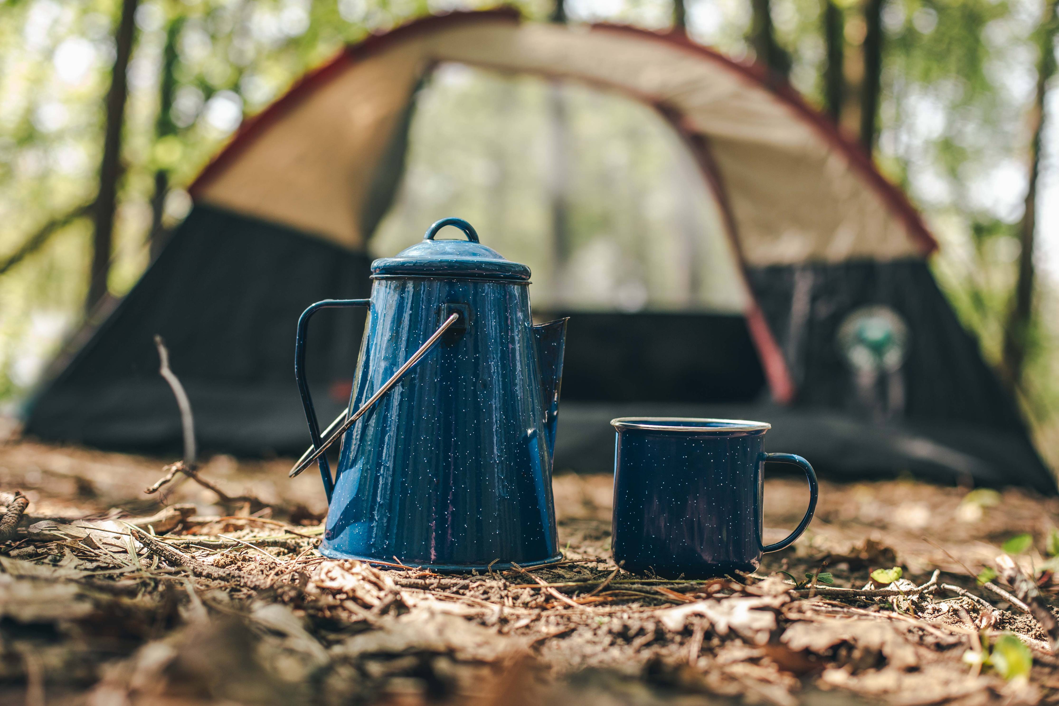 Kettle and cup in campsite